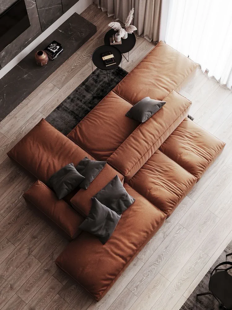 Aerial view of terracotta sectional sofa with grey pillows