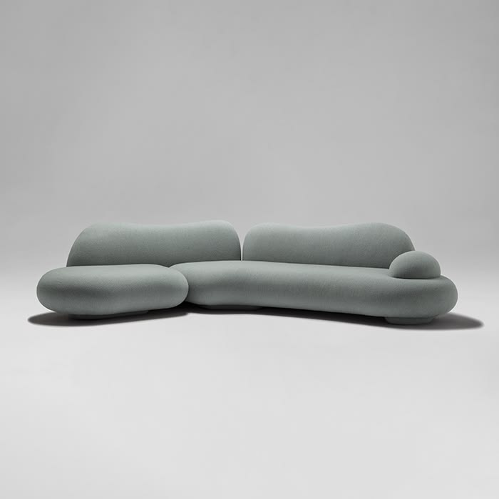 Sage green cloud-shaped sculptural sofa