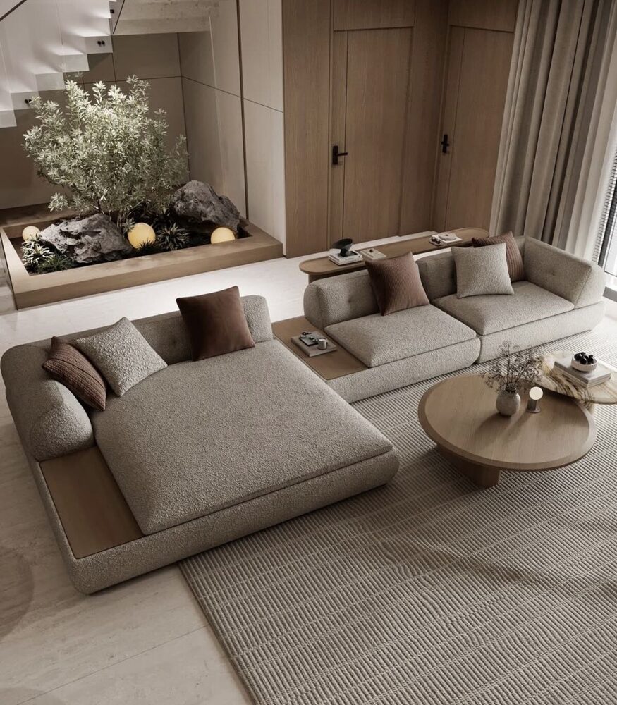 Warm neutral living room with sculptural sofa